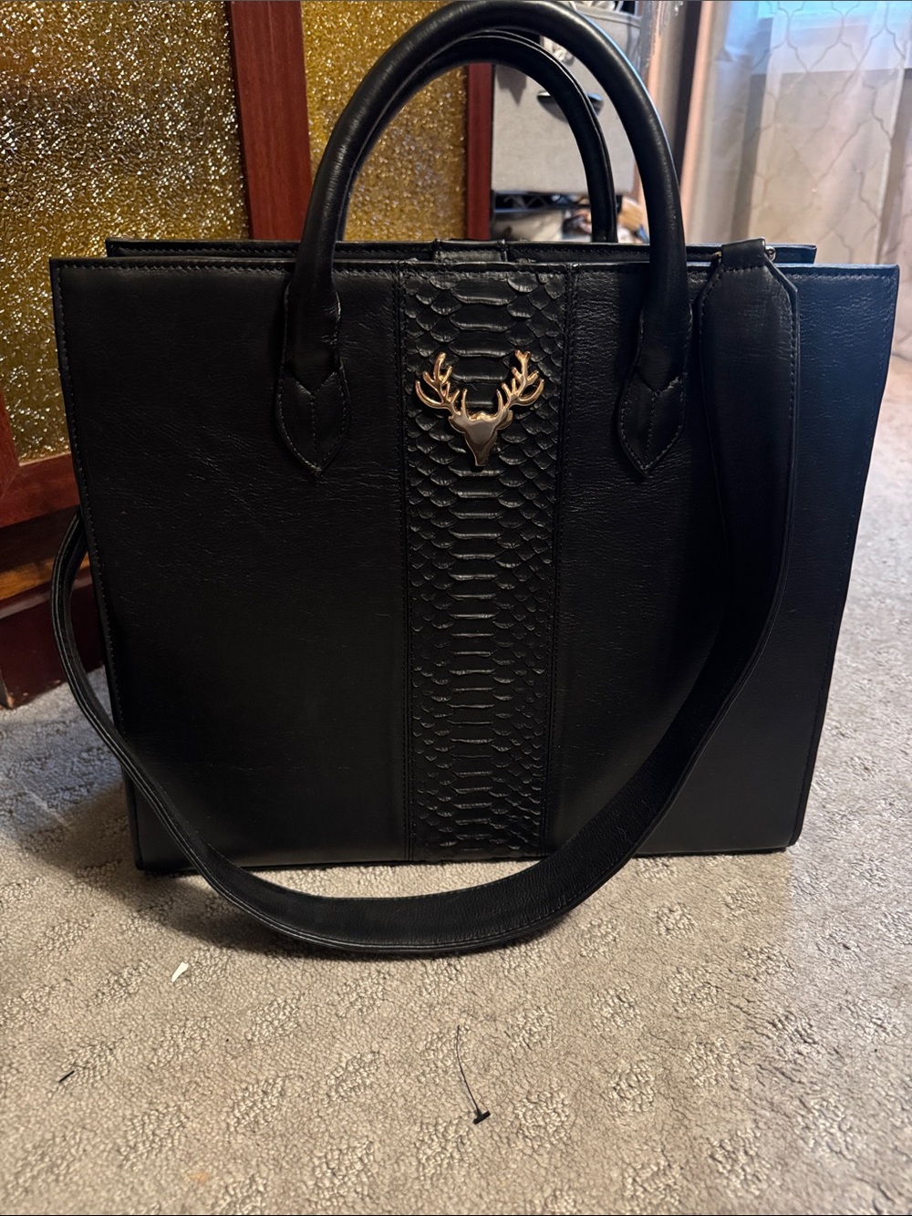 Taxidermy Amy tote. Structured Black Tote with Gold Stag Accent.